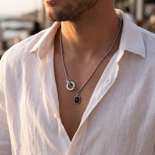 Man wearing El Código roman numeral disc necklace