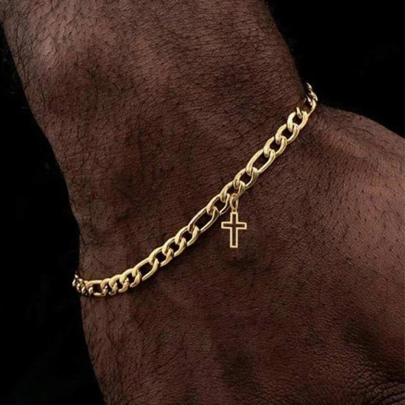 La Cruz gold cross charm bracelet worn on a man's wrist