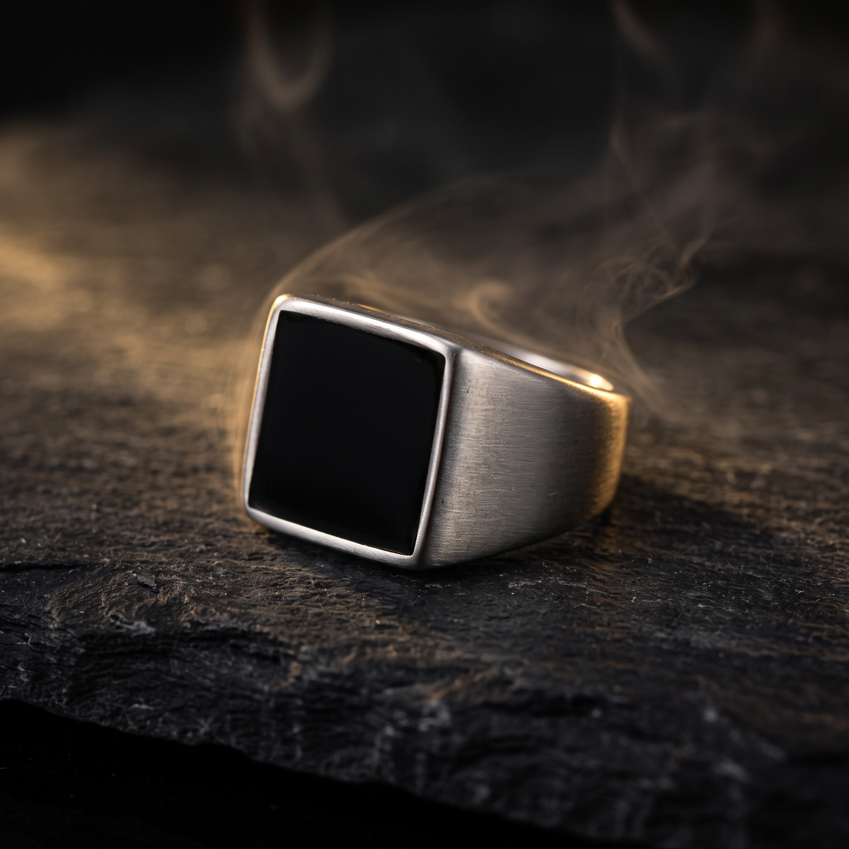 El Sello black square signet ring for men on dark slate, stainless steel