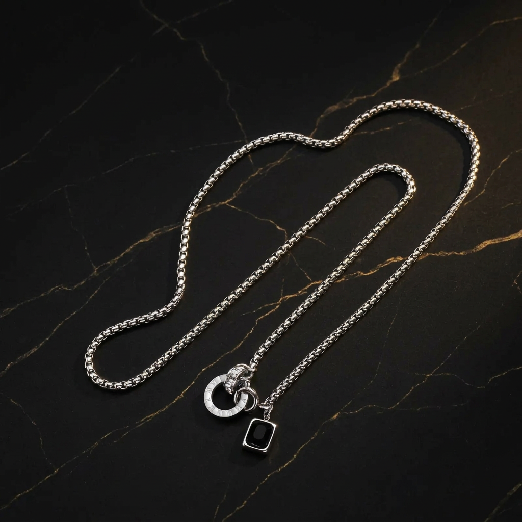 Full silver necklace on black marble with gold veining