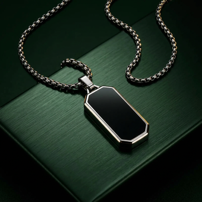 Single silver pendant on dark-green metal