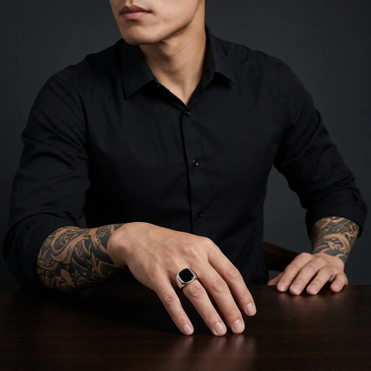 Tattooed Asian male model showcasing the silver black-stone ring