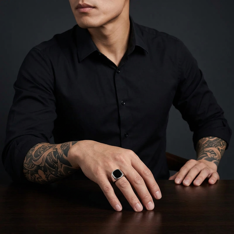 Tattooed Asian male model showcasing the silver black-stone ring